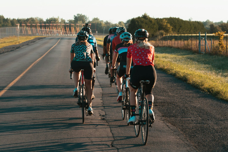 Group of cyclists riding together during a community cycling event
