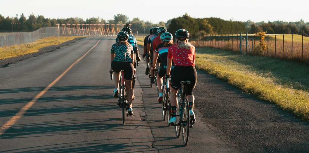 Group of cyclists riding together during a community cycling event