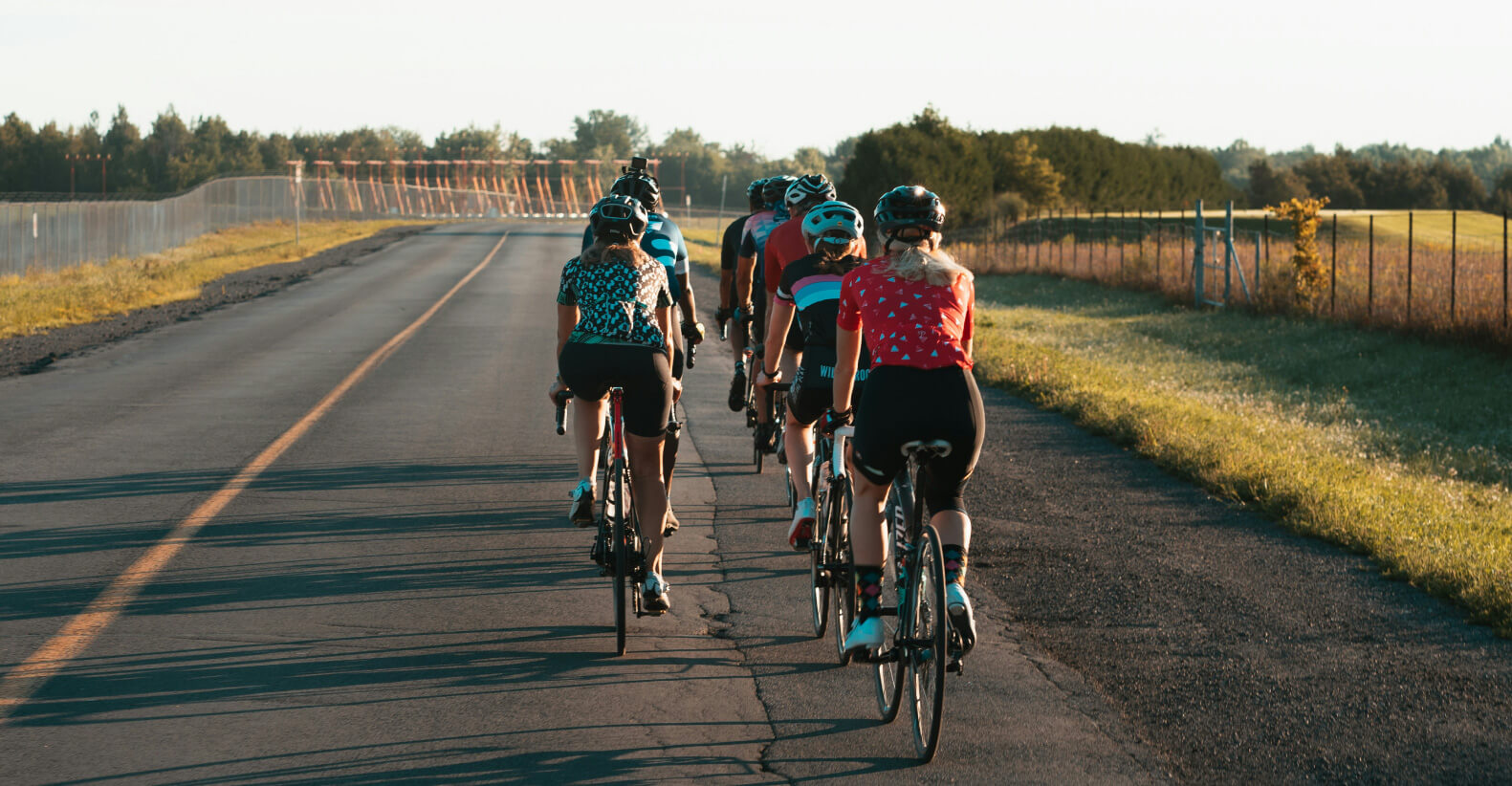 Group of cyclists riding together during a community cycling event